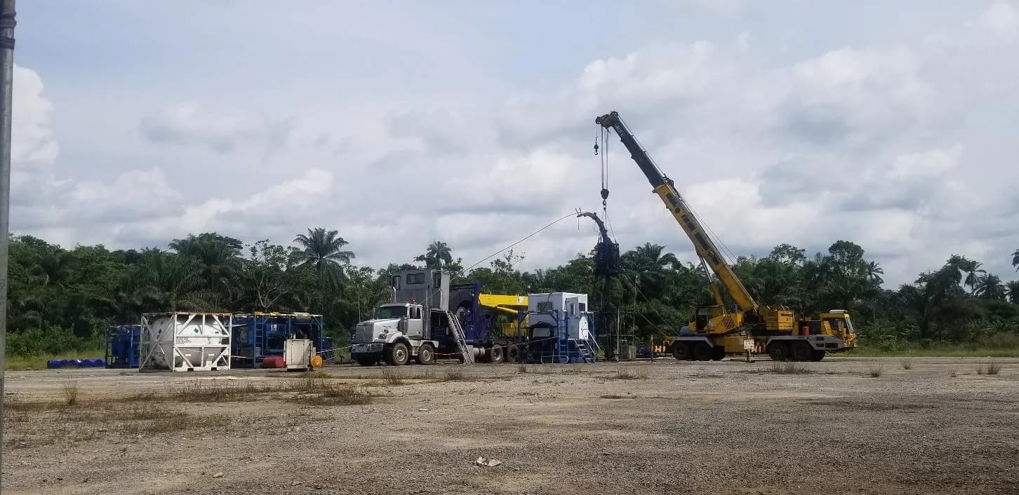 Coil tubing spread rigged up on location, with crane and support equipment
